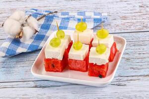 Watermelon with feta and grape photo