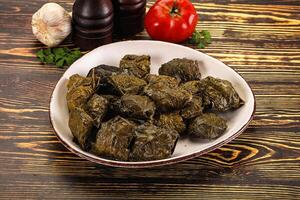 Stuffed dolma - meat in grape leaves photo