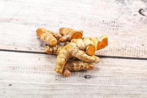 Fresh young Tumeric root heap photo