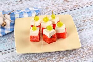 Watermelon with feta and grape photo