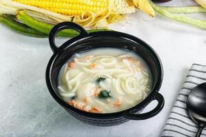 Soup with prawn and noodle photo