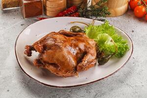 Baked small chicken with spices photo