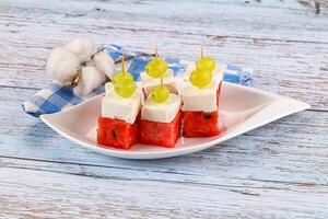 Watermelon with feta and grape photo