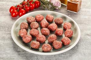 Uncooked raw beef meatball minced photo