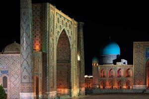 Samarkand, Uzbekistan-august 12, 2023-Particular of the Registan Square with a light show that illuminates all the buildings in the square during a summer night photo
