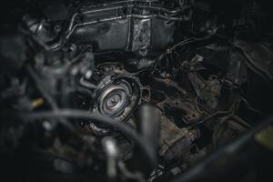 Torque converter sticking out of automatic transmission with engine removed on a modern car. photo