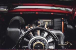 Open bonnet of a classic car displaying fully restored engine compartment. photo