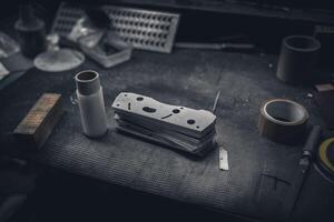 Flat metal parts during production on work table in a factory. photo