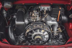 Open bonnet of a classic car displaying fully restored engine compartment. photo