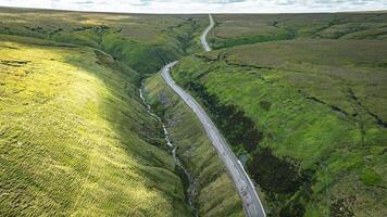 Aerial view of curvy windy roads on a moody summer day in Yorkshire, UK photo