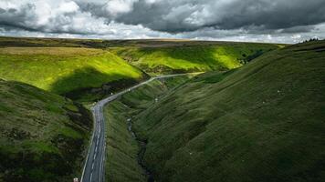 Aerial view of curvy windy roads on a moody summer day in Yorkshire, UK photo