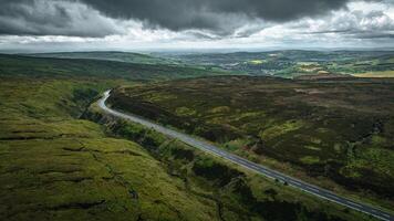 Aerial view of curvy windy roads on a moody summer day in Yorkshire, UK photo
