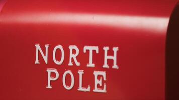 North Pole Sign on red Background photo