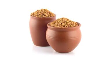 Two clay pots with food in them photo