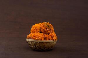 Marigold Zendu Flowers flowers in a bamboo basket. photo