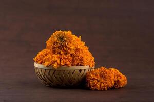 Marigold Zendu Flowers flowers in a bamboo basket. photo