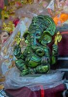 A statue of an elephant sitting on a table photo