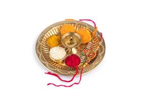 An image of a plate with colorful rakhi photo