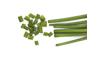 Fresh ripe green spring onions shallots or scallions with fresh chopped green onions on white background photo