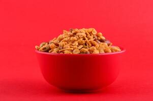 A bowl of cereal on a red background photo