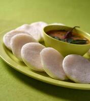 A plate with some small white dumplings on it photo
