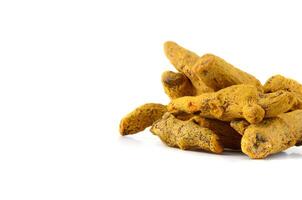 Dry Turmeric roots or barks isolated on white background photo