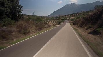 A blurry image of a road with mountains in the background video