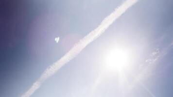 A plane flying in the sky with contrails video