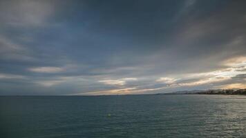 A cloudy sky over the ocean with a boat in the distance video