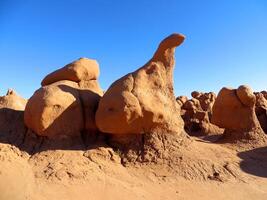 Sandstone Boulder that Looks Like a Dinosaur at Goblin Valley State Park, Utah photo