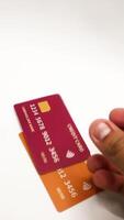 Hand Displaying Colorful Credit Cards for Digital Transactions. video