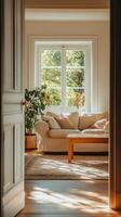 Door opening into bright living area, soft colors, cozy couch, coffee table, natural light, blurred background details, spacious feel. photo