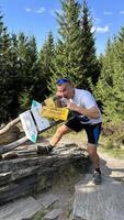 Tourist on the top of Mount Kovadlo, Eastern Sudetes, Polish-Czech border photo