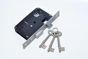 Closeup three keys white background photo