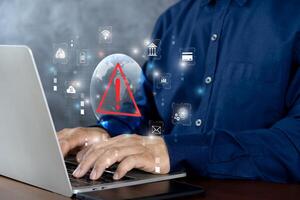 System hacked warning alert on notebook Laptop. Cyber attack on computer network, Virus, Spyware, Malware or Malicious software. photo