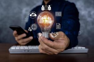 Hand holding Light bulb, Global Internet connection cloud computing. Business global internet connection application technology, digital marketing. photo