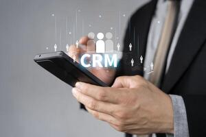 CRM Customer Relationship Management concept, Businessman using CRM software for business marketing photo