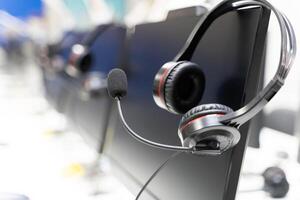 The headset is a standard piece of equipment for call center agents, and it allows them to communicate with customers over the phone. photo