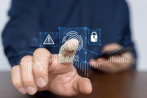 Access control concept. Businessman using mobile smartphone with virtual access control icon. photo
