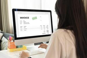 Businesswoman check company finances and earnings and budget. Online Digital E Invoice And Statements Software. photo