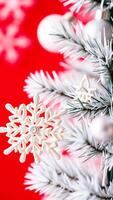 delicate white snowflake ornament adorns a snowy evergreen branch photo