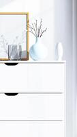white dresser with sunlight shining through a window photo
