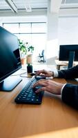 hands typing on a keyboard a bright office photo
