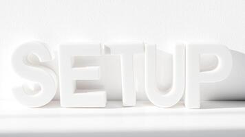 white plastic letters spelling setup on a white background photo