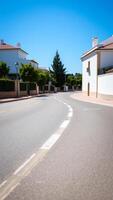 curving road through a sunny suburban neighborhood photo