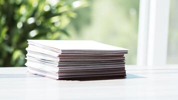 stack white paper brochures on a table photo
