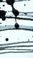 black paint splashes on white surface photo
