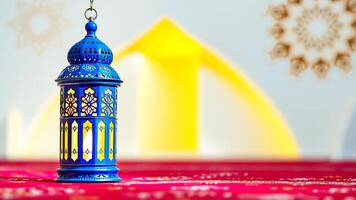 blue ornate lantern on a red surface photo