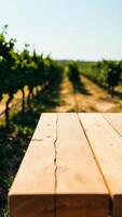 wooden table against a blurred background green plants photo