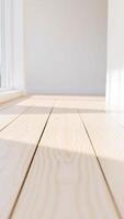light wood floor with sunbeams streaming through window photo